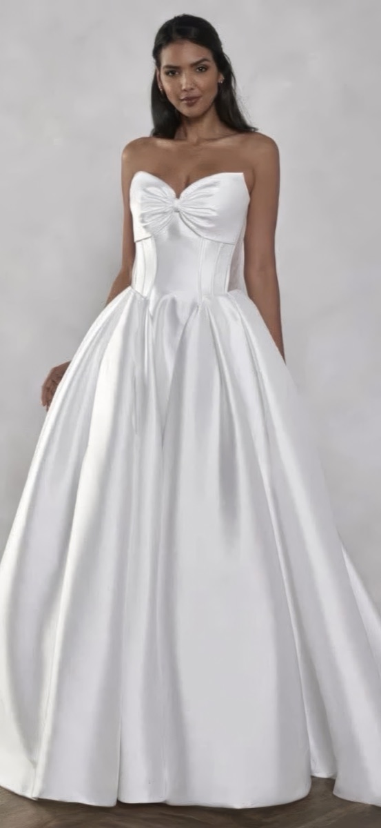 A bride in a strapless satin ballgown